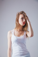 Fototapeta premium A young beautiful woman standing in underwear