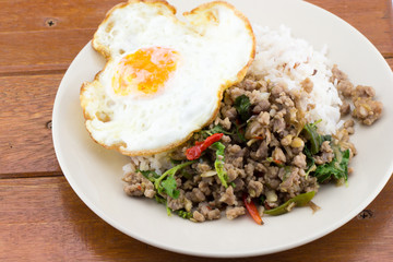 Rice topped with stir-fried pork and basil and fried egg 