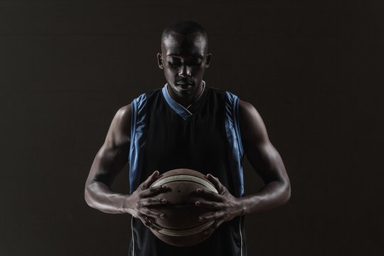 Portrait of basketball player holding a ball