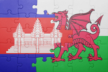 puzzle with the national flag of wales and cambodia