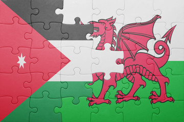 puzzle with the national flag of wales and  jordan