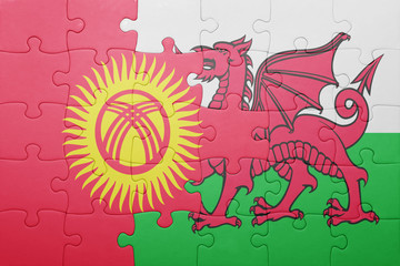puzzle with the national flag of wales and  kyrgyzstan