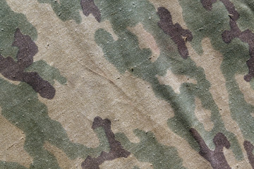 Old camouflage cloth texture.