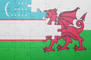 puzzle with the national flag of wales and  uzbekistan