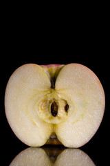 half a red apple with black background  on space for text