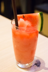 Watermelon juice under warm light 