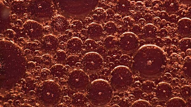 Red Liquid and Bubbles in Motion