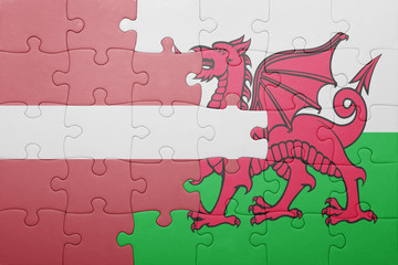 puzzle with the national flag of wales and latvia