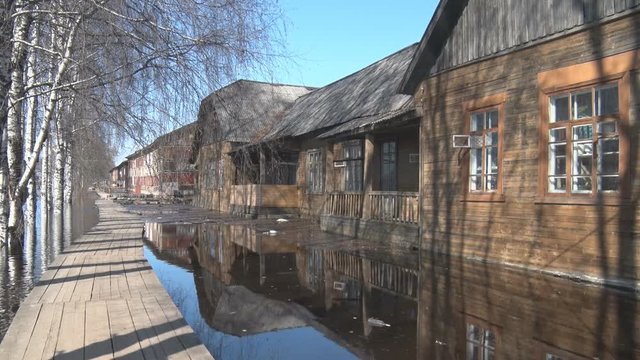 Flooding Spring in Village. The house stands in water during floods in the village. The village is flooded with water in spring.