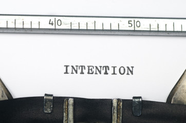 word intention typed on old typewriter