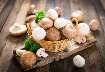 Champignon mushroom on the wooden table - Powered by Adobe