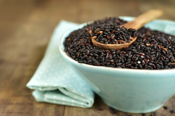 Blue ceramic bowl of black rice.