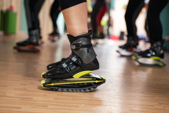 group of people doing exercises with  kangoo shoes