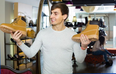 guy shopping at fashion shoe store