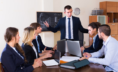 Manager scolding his team severely during