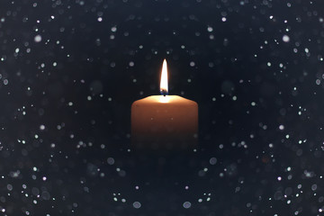 candle light isolated black with snow