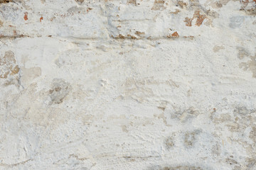 Wall fragment with attritions and cracks