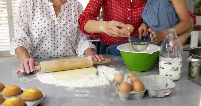  Cute family preparing a cake