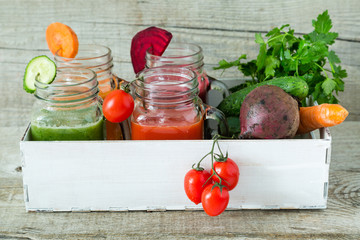 Selection of colorful vegetable juices in glass jars