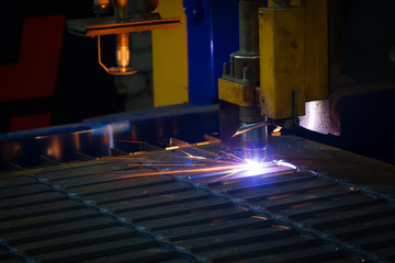 Metal sparks. Industrial laser and plasma cutting of sheet steel