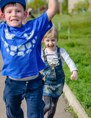 Vivacious pretty little girl running and laughing