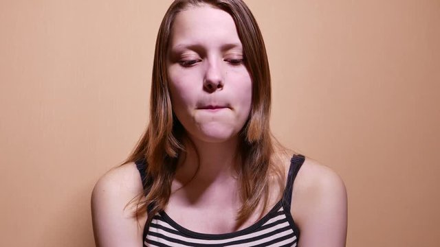 Sad depressed teen girl almost crying. 4K UHD