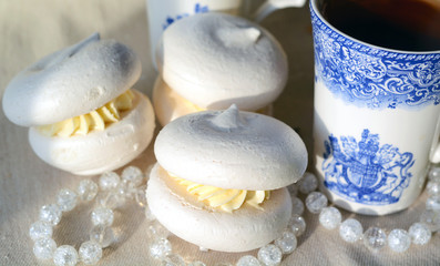Meringue with cup of tea