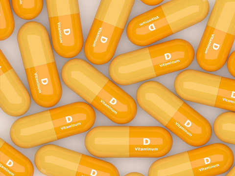 Vitamin D Pills Lying On Table
