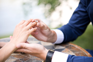 Loving couple hands. Making proposal and proposal ring  