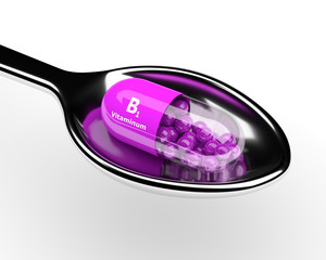 3d vitamin B1 pill on spoon over white