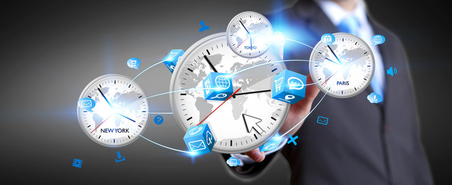 Businessman connecting time of the world in his hand