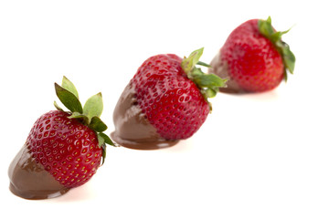 three strawberries in a slant line
