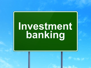 Currency concept: Investment Banking on road sign background