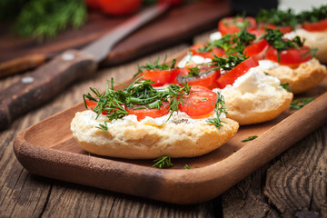 Delicious bruschetta with tomatoes, feta cheese, dill and spice