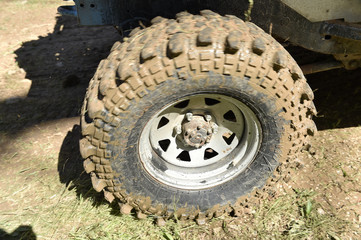 Fototapeta na wymiar 4x4 vehicle with tires full of mud to an off-road competition 