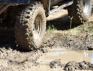 Fototapeta na wymiar 4x4 vehicle with tires full of mud to an off-road competition 