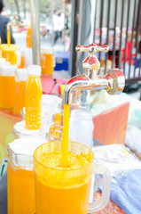 Orange juice pouring