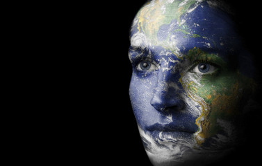 Woman face painted with earh 