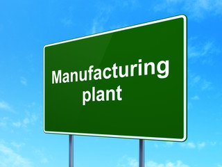 Industry concept: Manufacturing Plant on road sign background