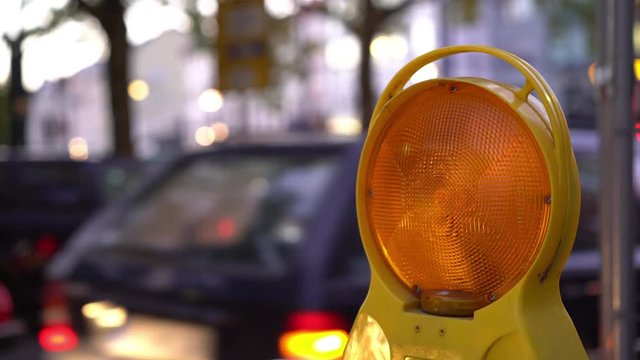 Flashing light warning travelers of construction.
