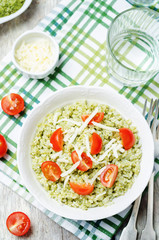 Pesto rice with tomatoes and cheese