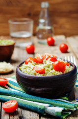 Pesto rice with tomatoes and cheese