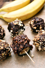 Frozen banana covered with chocolate