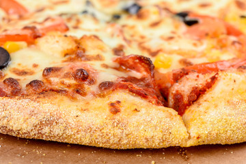 Italian Pizza With Mozzarella, Prosciutto, Tomatoes And Olives