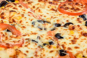 Italian Pizza With Mozzarella, Prosciutto, Tomatoes And Olives