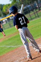 Youth little league baseball batter.