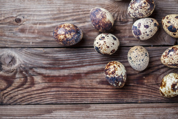 Fototapeta premium Group of quail eggs on thewooden background