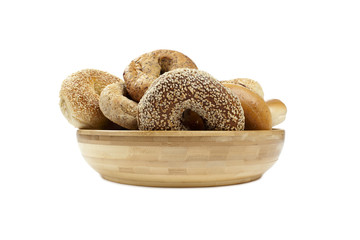 wooden bowl with bunch of bagels
