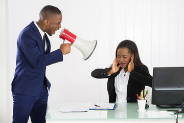 Boss Shouting At Young Businesswoman