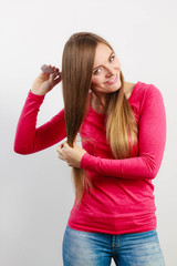 Fototapeta premium Woman combing her hair.